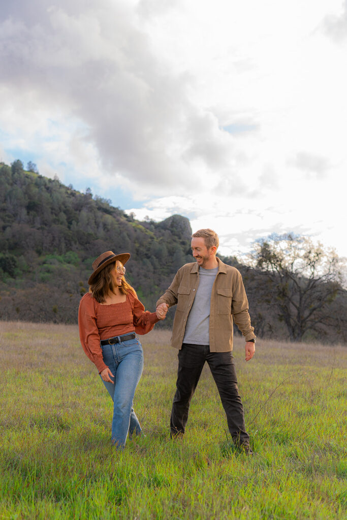 Couple together in an open field along the Mt. Diablo mountainside in the Bay Area, California