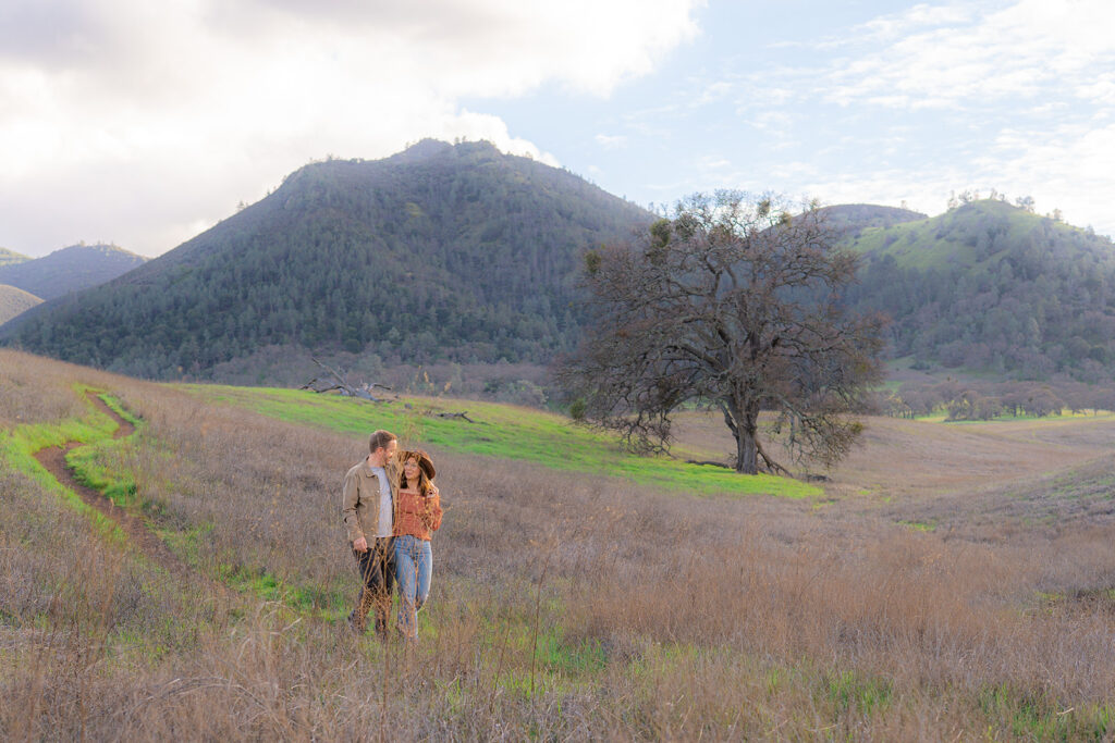 Couple in an open field at the Mt. Diablo summit during a Bay Area couples photography session