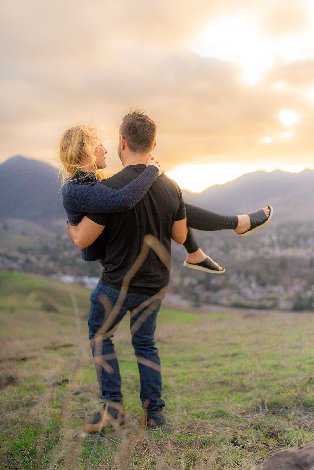 Couple photographed at sunset overlooking the mountains and city of San Ramon, California