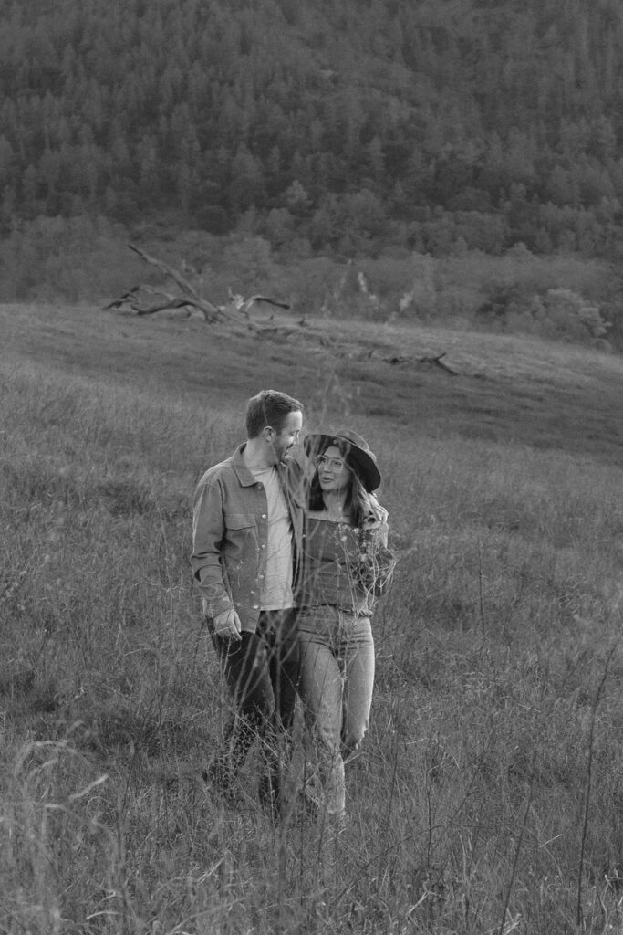 Couple together in an open field along the Mt. Diablo mountainside in the Bay Area, California